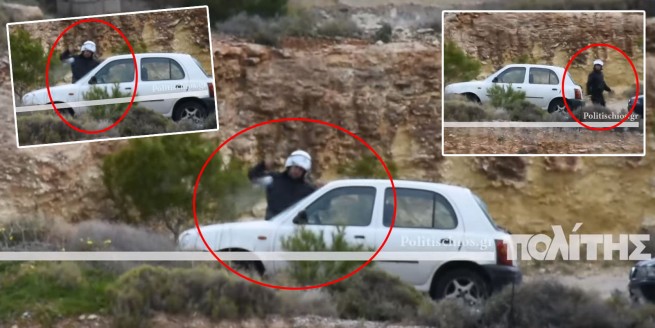 Скрин из  видео, где  видно, как полицейский бьет окна в автомобилях